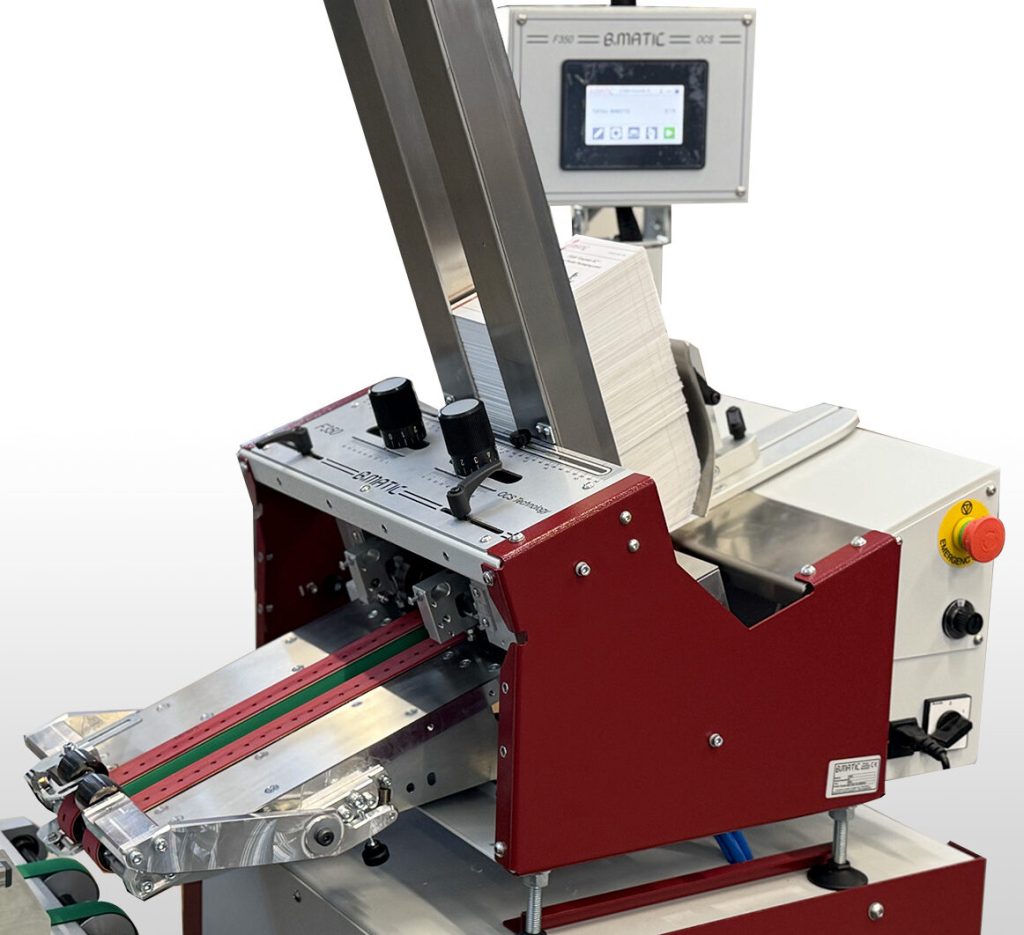 Friction Feeder with increased length output and vacuum feeding belts